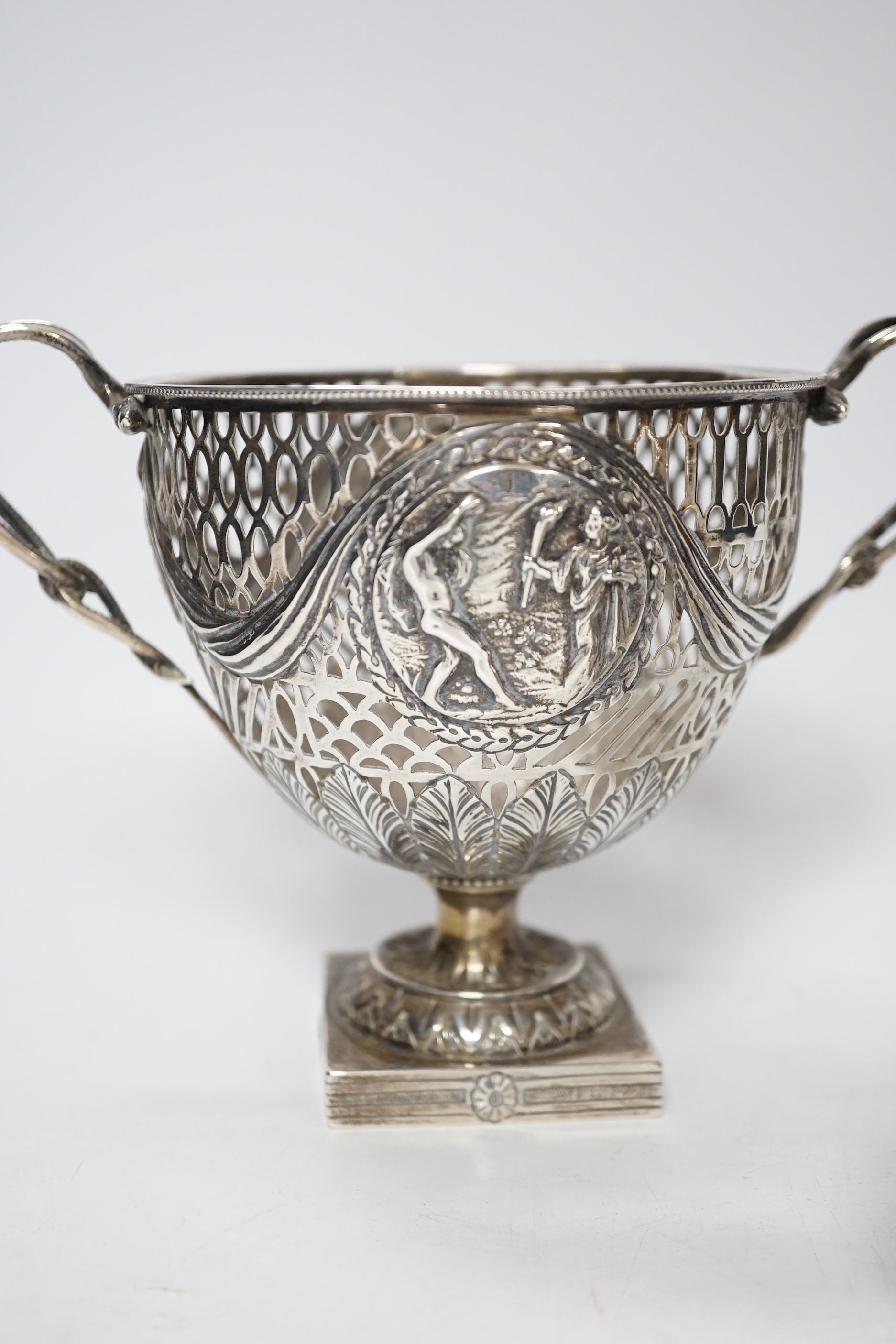 A pair of Thai circular white metal bowls, and a pair of small bowls, all decorated with animals and foliate scrolls, inscribed on bases, diameter 12cm and 8.5cm